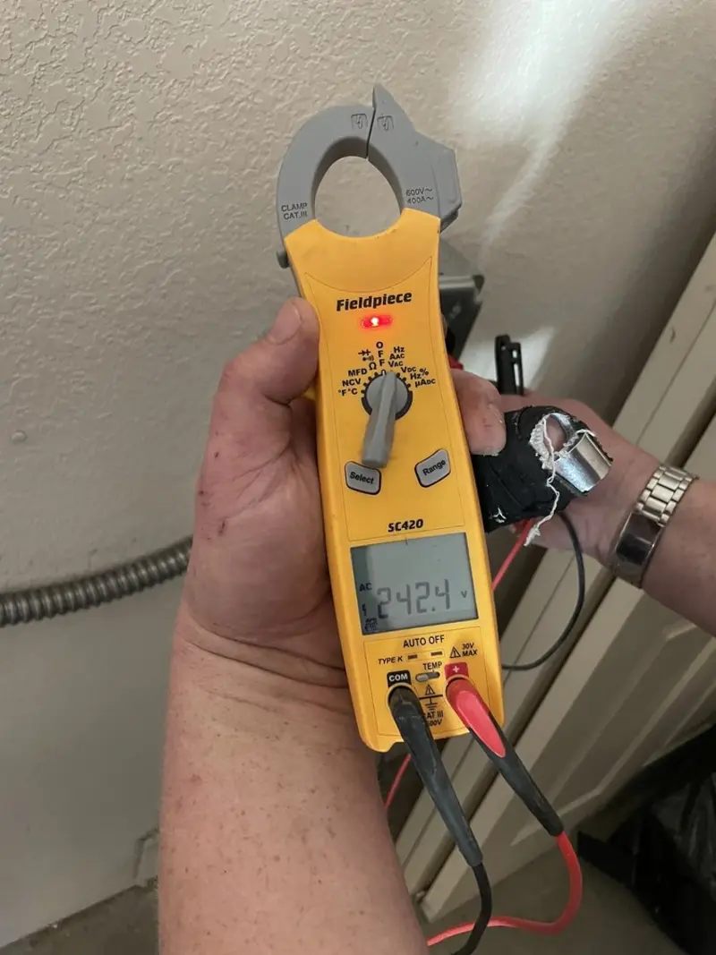 Voltage testing with clamp meter during Generator Installation in Pine Creek